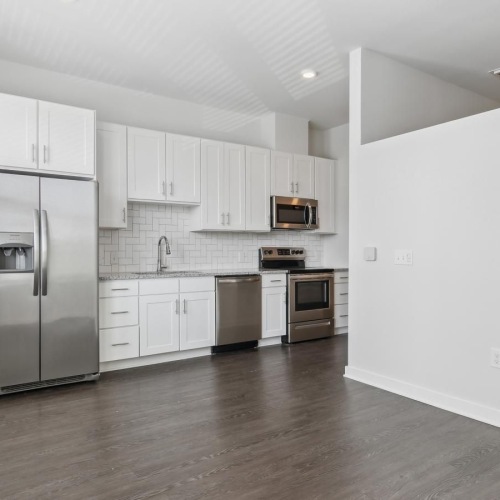 a kitchen with white cabinets