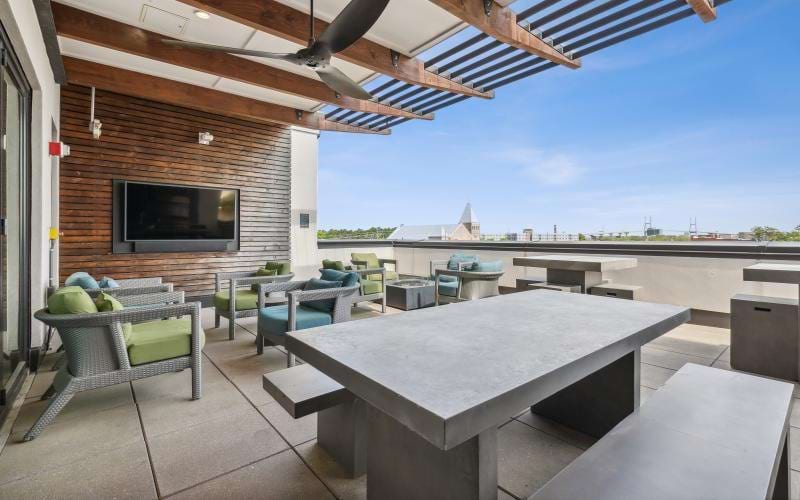 a patio with a table and chairs