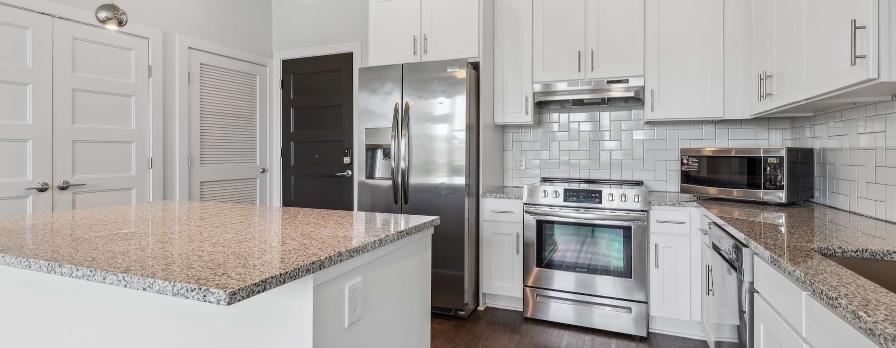 a kitchen with white cabinets